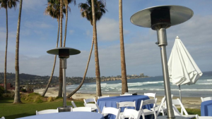 ocean, palm trees, La Jolla pennisula, green lawn with white chairs; breakfast view for lipids conference